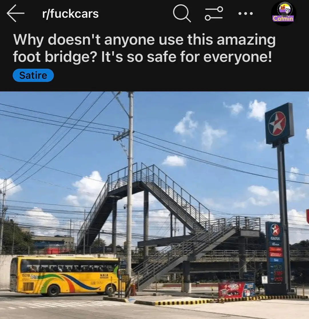 The meme is a photo of a bus stopping at an intersection in front of a footbridge. The image is accompanied by the text "Why doesn't anyone use this amazing foot bridge? It's so safe for everyone!" The tone is sarcastic and ironic, implying that the bridge is actually a hazard.